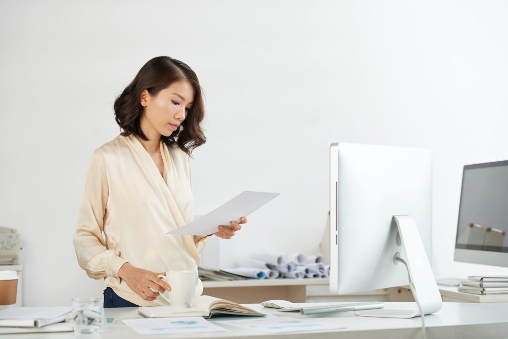 Vietnamese business woman checking document
