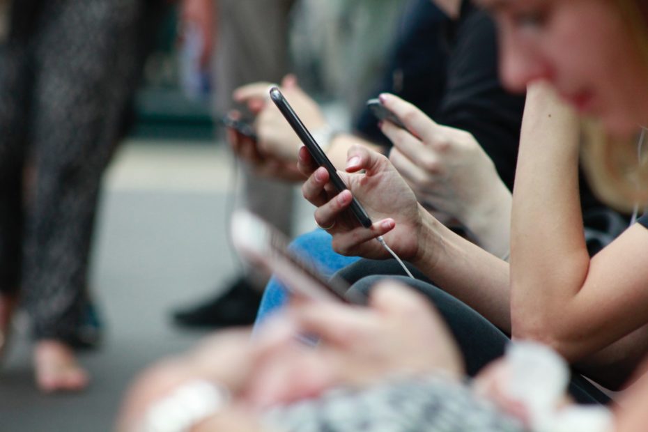 People looking at their phones